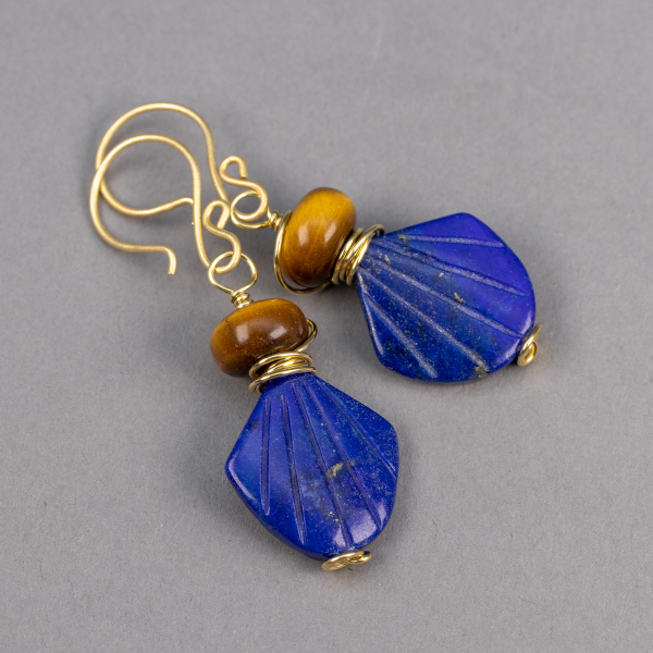 Beaded earrings with fan shaped lapis stones topped with tiger's eye rondels.