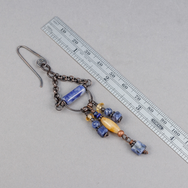 Blue and Yellow Stone Dangle Earrings Shown Next to a Ruler