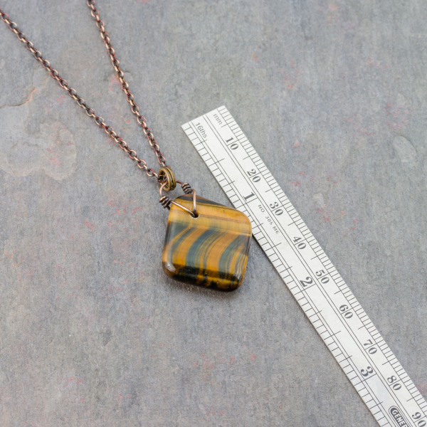 Brown Tiger's Eye Stone is Roughly 1 inch Wide by 1 inch Long