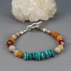 Large Turquoise Flat Chips are at the Center of this Stone Bead Bracelet