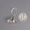 Clear Faceted Gemstone Earrings Shown Next to a Dime Coin