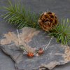 Three jasper stones are set in the front of this delicate sterling silver chain
