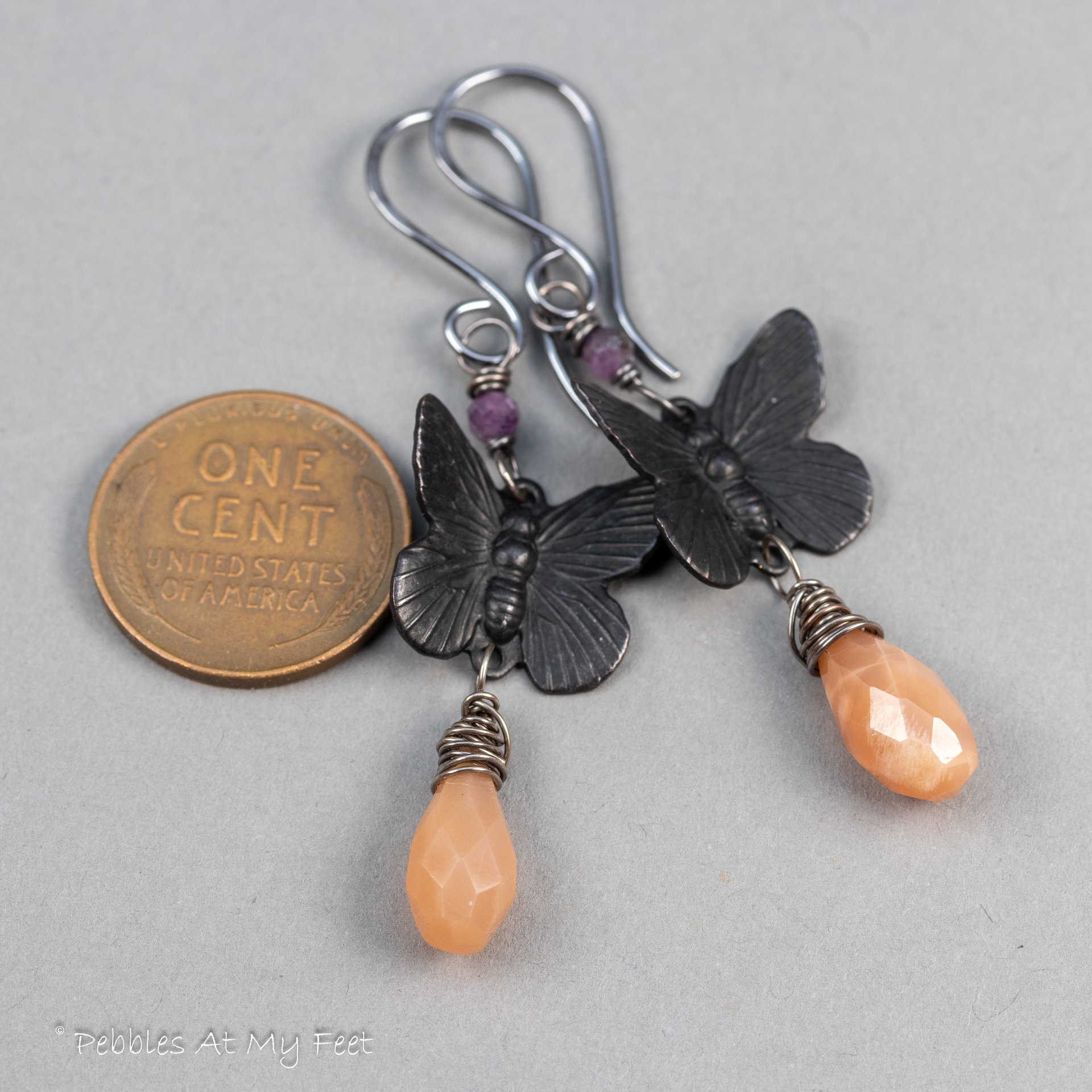 Peach Moonstone Dangle Earrings with Black Brass Butterflies and Purple Rubies