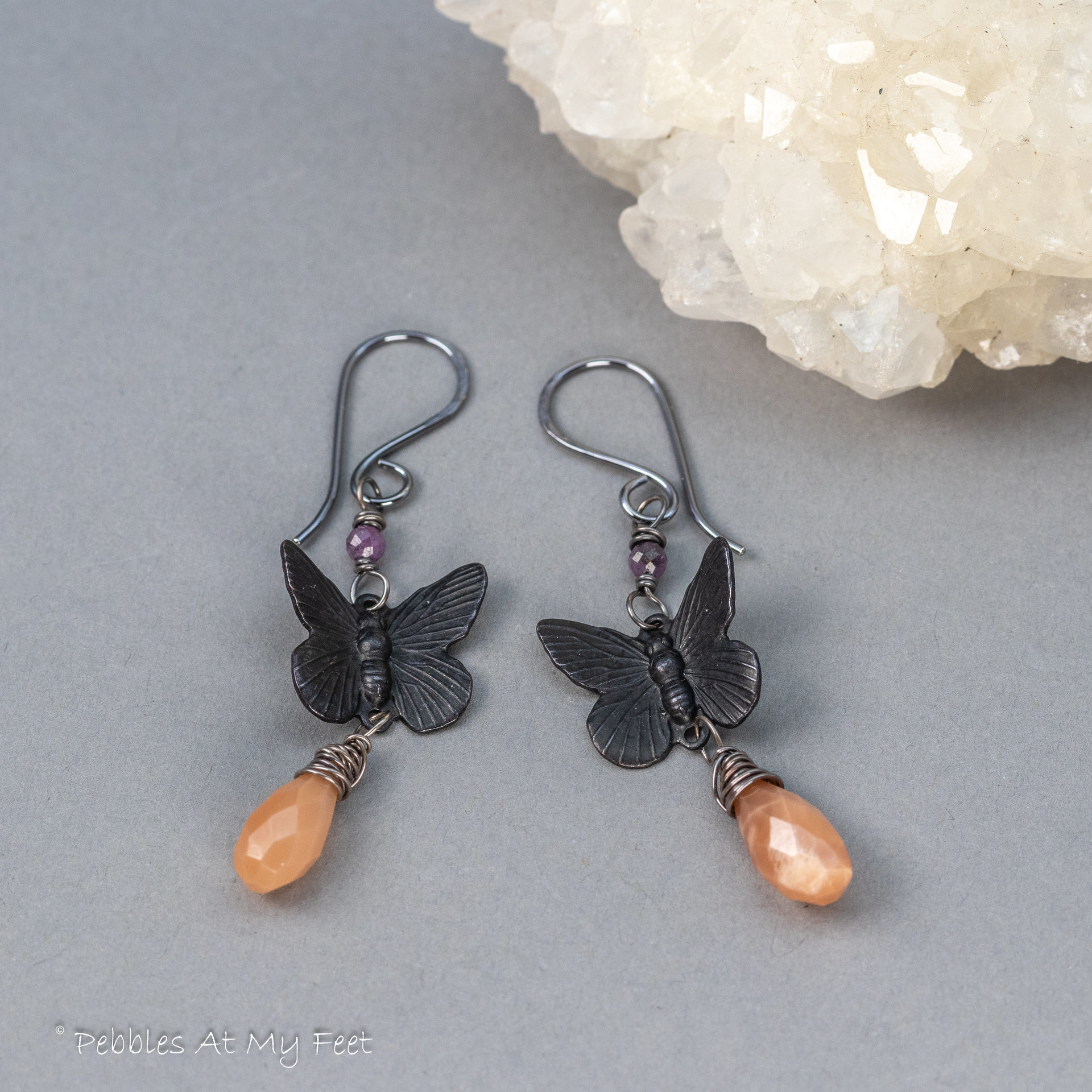 Peach Moonstone Dangle Earrings with Black Brass Butterflies and Purple Rubies
