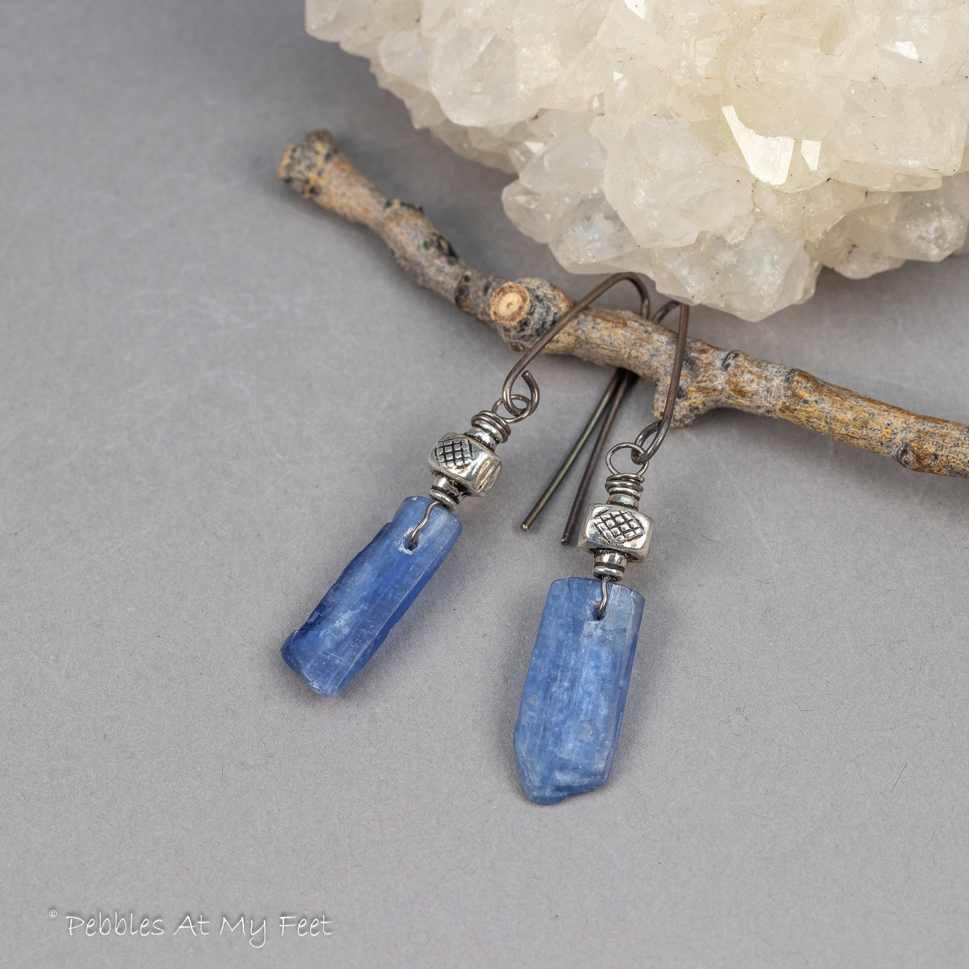 Blue kyanite stones have a silvery sheen in these handmade earrings by Pebbles At My Feet